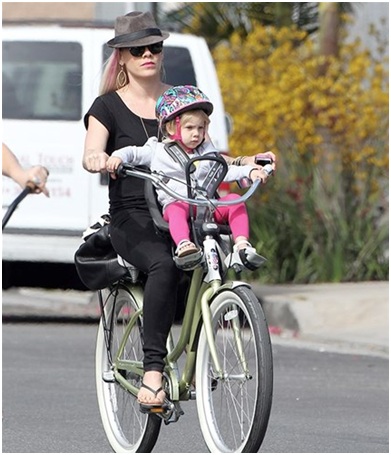 pink bicycling with her daughter